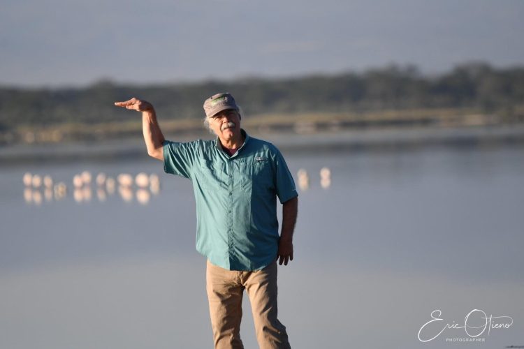 tourist-enjoying-elementaita-lake-view-with-flamingoes